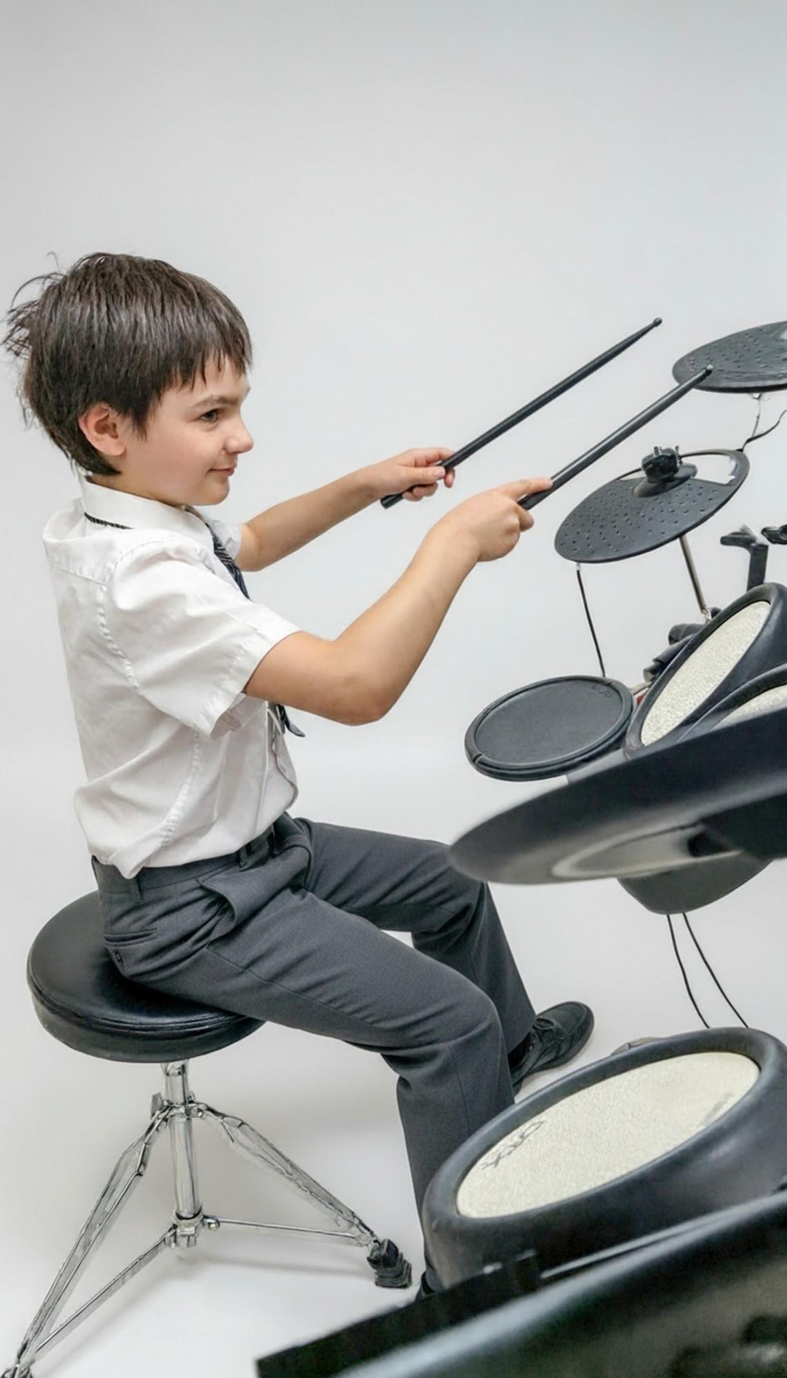 A student playing the drums