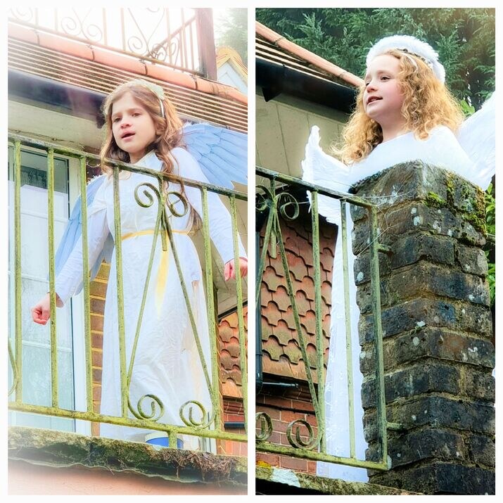 Young children dressed as angels in a College production